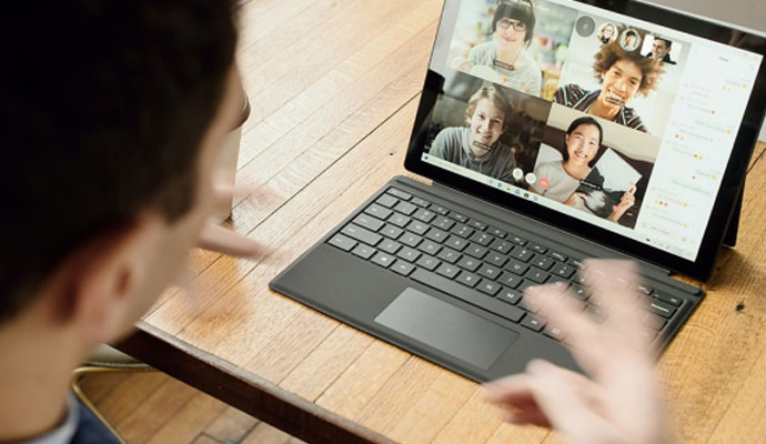 man on video call at desk